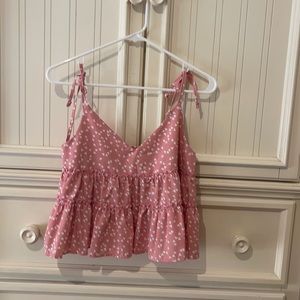 pink blouse with small white heart print
